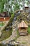 Waterfall with steps with small house in park