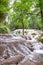 Waterfall steps among trees