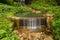 waterfall stone green moss rain forest