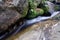 Waterfall with stone of green moss in rain forest , Kiriwong Vil