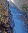 Waterfall with sunlight in the mountains, Ala-Archa, Kyrgyzstan.