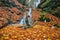 Waterfall in Tajovska dolina gorge near Tajov village during autumn