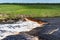 Waterfall on the Tosno River with rapids and stony shore.  Sablino. Leningrad region. Russia