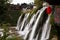 Waterfall under the ancient architecture at Furong Town of China