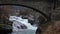 Waterfall under bridge in Bovra river in Lom in Norway in autumn