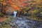 Waterfall with vibrant trees in autumn, Tometaki waterfall - Kazuno, Akita, Japan