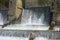 A waterfall weir in a non-urban scene day