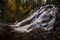Waterfalls in boreal autumnal forest in Norway