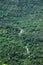 Waterfalls in a mountain densely covered by trees