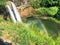 Waterfalls with rainbow at Wailua Falls on Kauai Hawaii