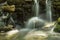 Waterfalls and streams of water among rocks and boulders