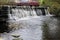 Waterfalls weirs cascade on small river