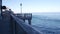 Waterfront boardwalk, Monterey California. Beachfront aquarium on Cannery Row.