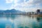 Waterfront of the city of Muscat, Oman, with buildings in the foreground & surrounded by mountains behind