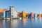 Waterfront with colorful wooden houses in Dutch Reitdiep harbor, Groningen