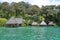 Waterfront ecolodge with thatched hut overwater