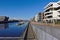 Waterfront of the Europa harbor in Bremen, Germany with moored sailing yachts and modern office and luxury apartment buildings