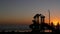 Waterfront kids playground silhouette. Children slide, beachfront recreation area. California USA