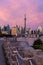 Waterfront path leading to a colorful pink sunset above the Toronto skyline. Trillium Park