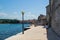 Waterfront of Porec Parenzo, Croatia, in the coastline of the Adriatic Sea with people walking and the remains of the medieval