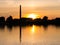 Waterfront silhouette of steam pumping station with museum at sunset, Medemblik, Netherlands