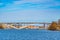 Waterfront of Stockholm with town hall at its end viewed through Vasterbron bridge, Sweden