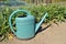 Watering can in vegetable garden