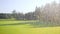 watering the lawn in slow motion on the golf course from two sides