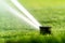 Watering the lawns of sports grounds with the help of automatic spray systems