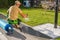 Watering Newly Installed Fresh Grass Turfs Inside a Garden