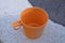 Watering plants in a bucket garden with water from a well