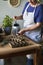 Watering the seeds planted in seedling trays