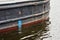 Waterline on hull of cargo ship, closeup