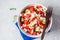 Watermelon, cucumber and feta cheese salad in white bowl, copy space