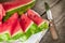 Watermelon cuts with wooden knife