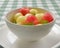 Watermelon granita ice cream. Melon and watermelon sorbet ice cream balls in a white bowl over green plaid table cloth