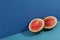 Watermelon halves on two tone background, space for text