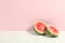 Watermelon halves on two tone background, space for text