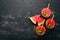 Watermelon juice with mint and ice in a glass. Melon. On a black wooden background. Free space for text.