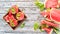 Watermelon juice with mint and ice in a glass. Melon. On a white wooden background. Free space for text.