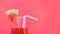 Watermelon juice summer with piece watermelon fruit on glass on red background