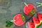 Watermelon juice top view over a dark stone background