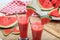 Watermelon juices preparation on a wooden table