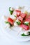 Watermelon kebab with spicy sauce, basil and mozzarella cheese