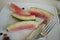 Watermelon leftovers and cutlery