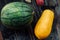 Watermelon and papaya whole lie on a wooden table. Fresh, juicy, delicious tropical fruits of Thailand.