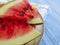 watermelon piece organic summer nature seasonal refreshment of a plate on a blue wooden background