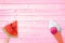 Watermelon popsicle and ice cream cone on pink planks background, summer concept