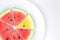 Watermelon red and yellow sliced on white plate
