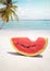 Watermelon on sandy tropical beach